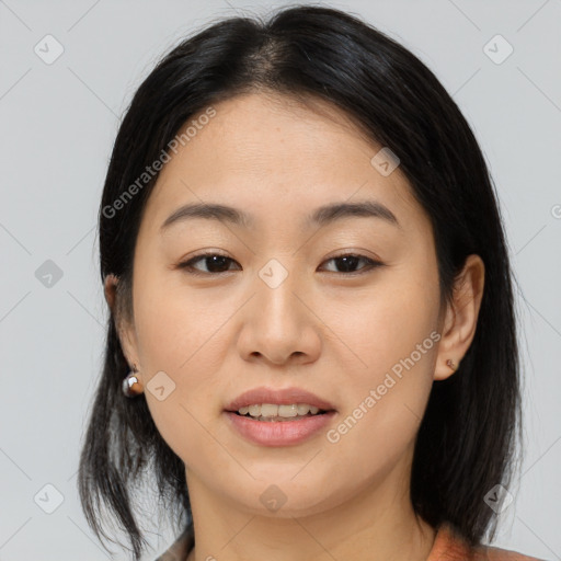 Joyful asian young-adult female with medium  brown hair and brown eyes