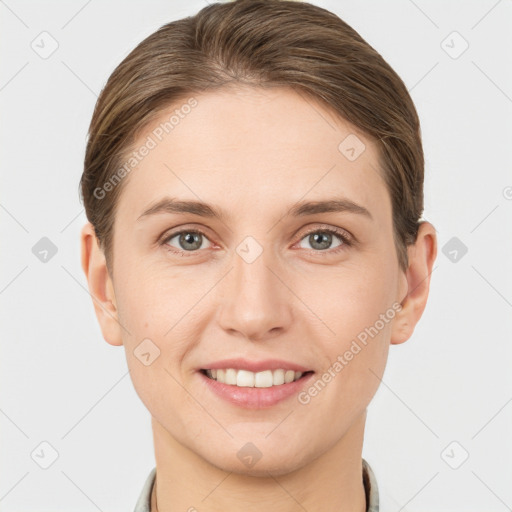 Joyful white young-adult female with short  brown hair and grey eyes