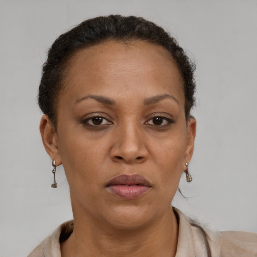 Neutral black adult female with short  brown hair and brown eyes