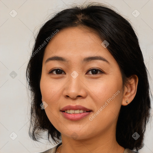 Joyful asian young-adult female with medium  brown hair and brown eyes