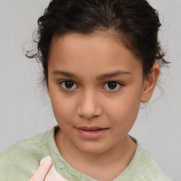 Joyful white child female with short  brown hair and brown eyes