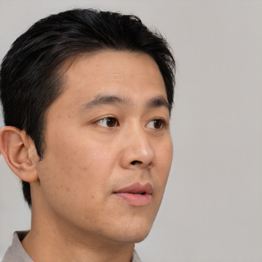 Neutral asian young-adult male with short  brown hair and brown eyes