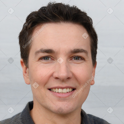 Joyful white adult male with short  brown hair and brown eyes