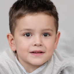 Joyful white child male with short  brown hair and brown eyes