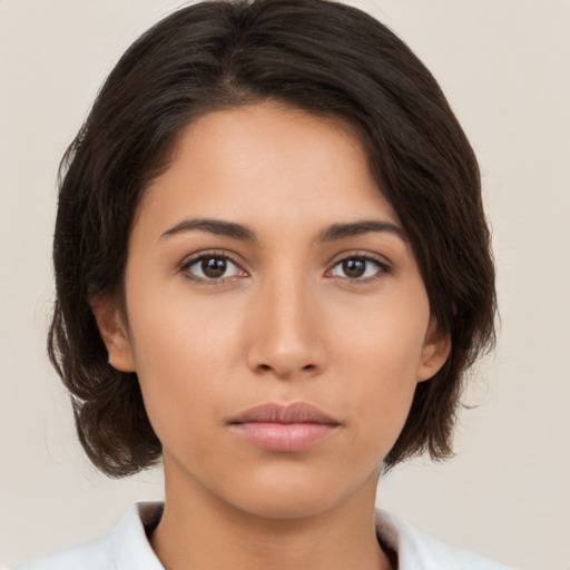 Neutral white young-adult female with medium  brown hair and brown eyes