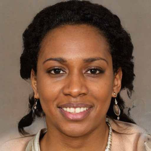 Joyful black young-adult female with medium  brown hair and brown eyes