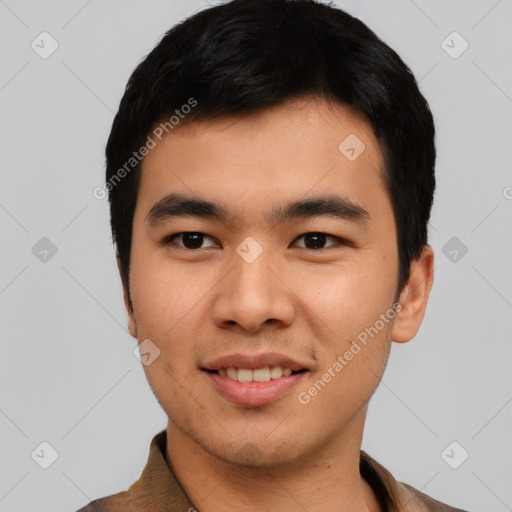 Joyful asian young-adult male with short  black hair and brown eyes