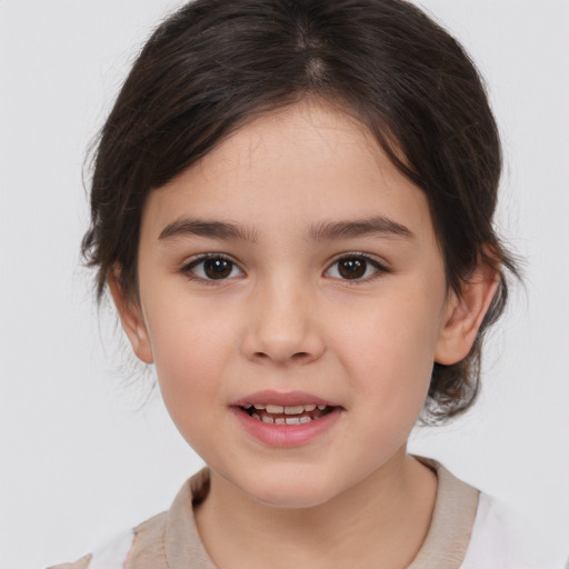 Joyful white child female with medium  brown hair and brown eyes