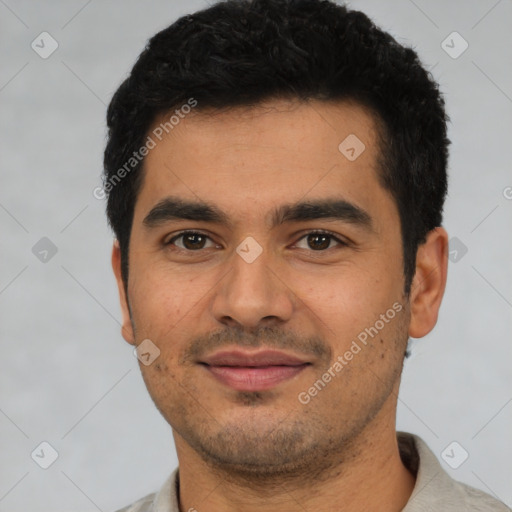 Joyful latino young-adult male with short  black hair and brown eyes