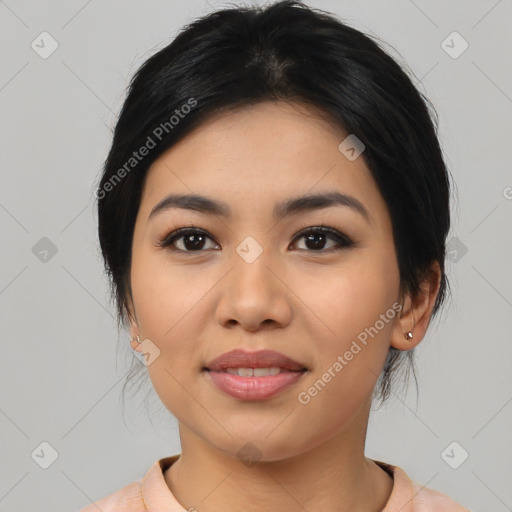 Joyful asian young-adult female with medium  black hair and brown eyes