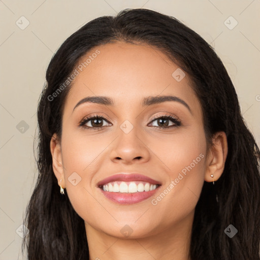 Joyful latino young-adult female with long  brown hair and brown eyes