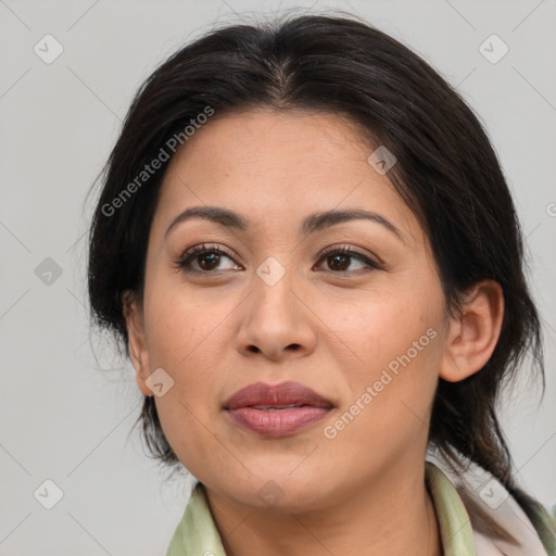 Joyful latino adult female with medium  brown hair and brown eyes