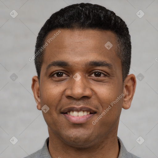 Joyful latino young-adult male with short  black hair and brown eyes