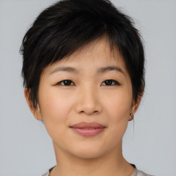 Joyful asian young-adult female with short  brown hair and brown eyes