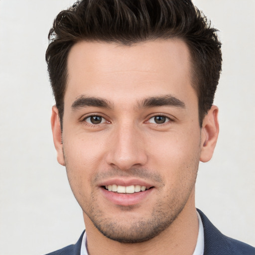 Joyful white young-adult male with short  brown hair and brown eyes