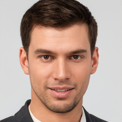 Joyful white young-adult male with short  brown hair and brown eyes