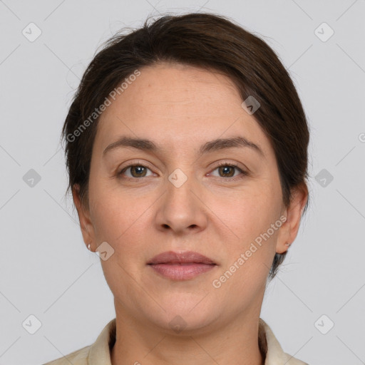 Joyful white adult female with short  brown hair and grey eyes