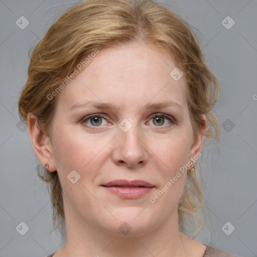 Joyful white adult female with medium  brown hair and blue eyes