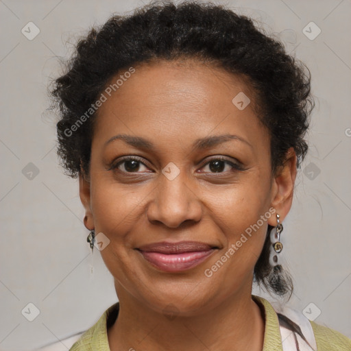 Joyful black adult female with medium  brown hair and brown eyes