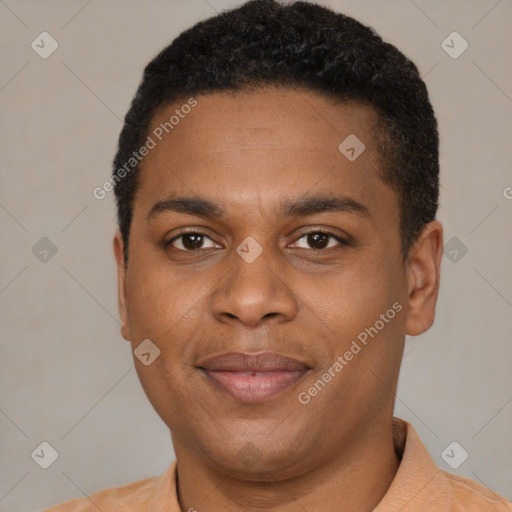 Joyful black young-adult male with short  brown hair and brown eyes