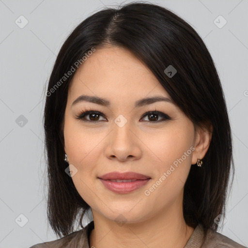 Joyful latino young-adult female with medium  brown hair and brown eyes