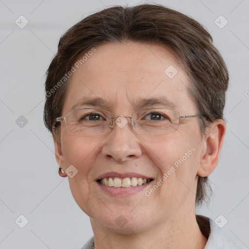 Joyful white adult female with short  brown hair and brown eyes