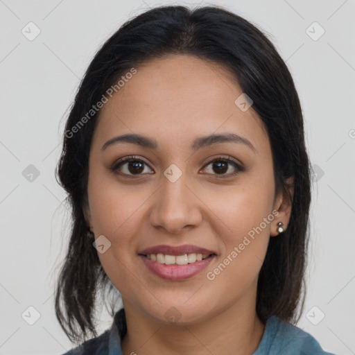 Joyful latino young-adult female with medium  brown hair and brown eyes