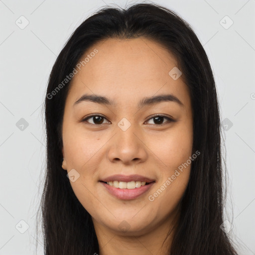 Joyful asian young-adult female with long  brown hair and brown eyes