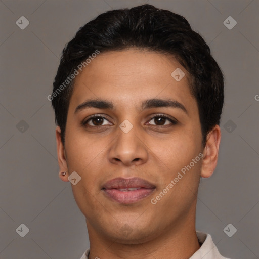 Joyful latino young-adult male with short  black hair and brown eyes