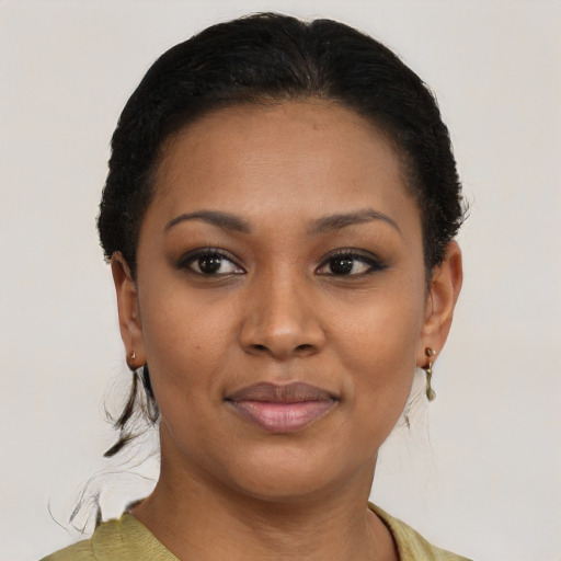 Joyful black young-adult female with short  brown hair and brown eyes