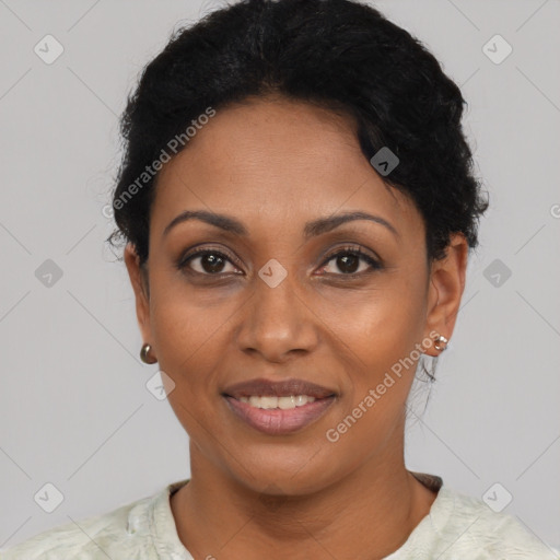 Joyful black adult female with short  black hair and brown eyes