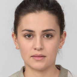 Neutral white young-adult female with short  brown hair and brown eyes