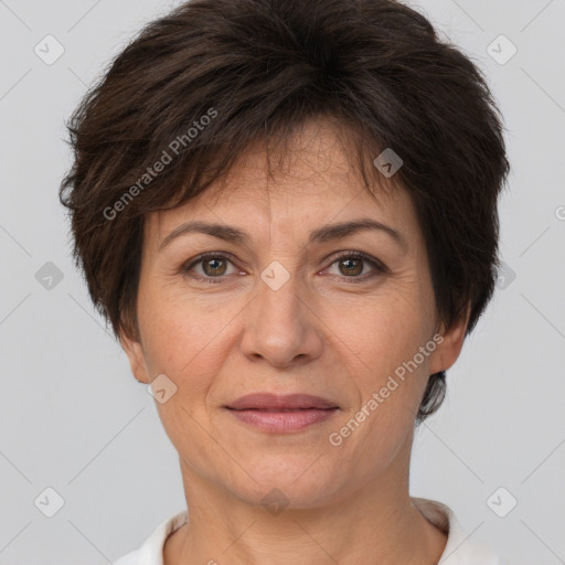 Joyful white adult female with short  brown hair and brown eyes