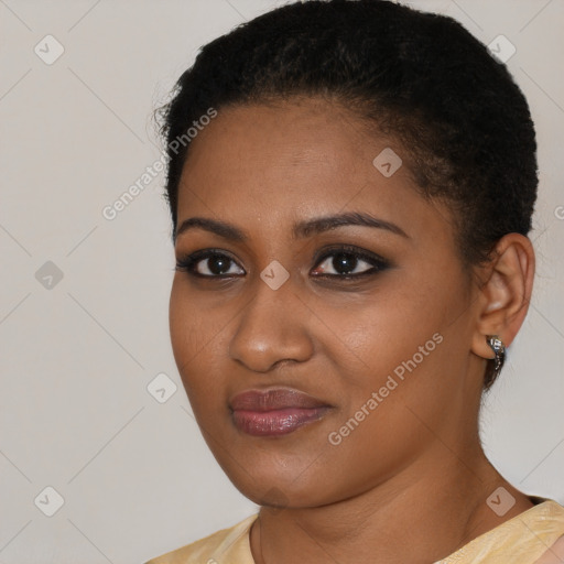 Joyful black young-adult female with short  brown hair and brown eyes