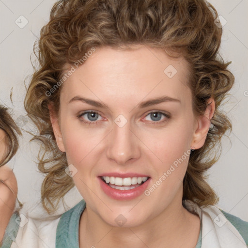 Joyful white young-adult female with medium  brown hair and blue eyes