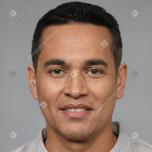 Joyful latino adult male with short  black hair and brown eyes