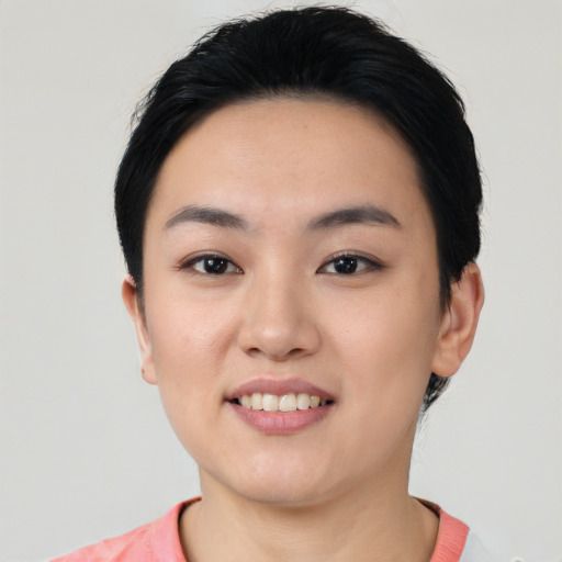 Joyful white young-adult female with short  black hair and brown eyes