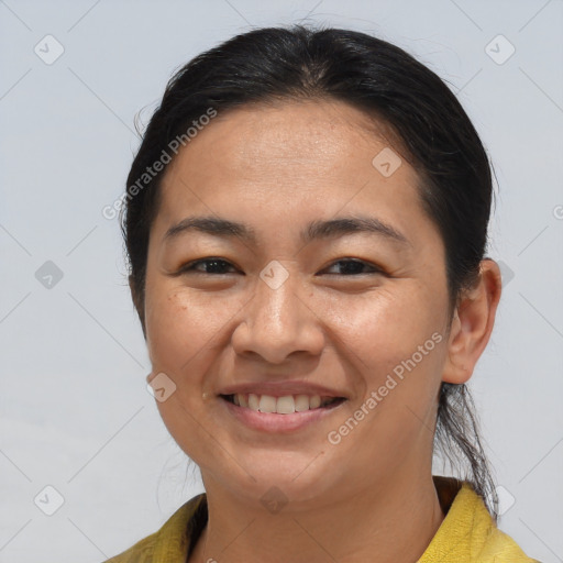 Joyful asian young-adult female with medium  brown hair and brown eyes