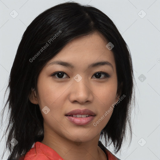 Joyful asian young-adult female with medium  black hair and brown eyes