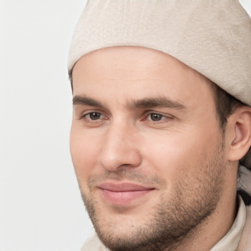 Joyful white young-adult male with short  brown hair and brown eyes