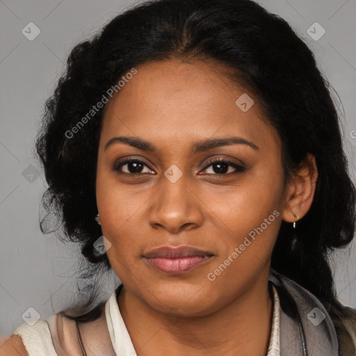 Joyful black young-adult female with long  black hair and brown eyes