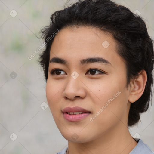 Joyful asian young-adult female with short  black hair and brown eyes