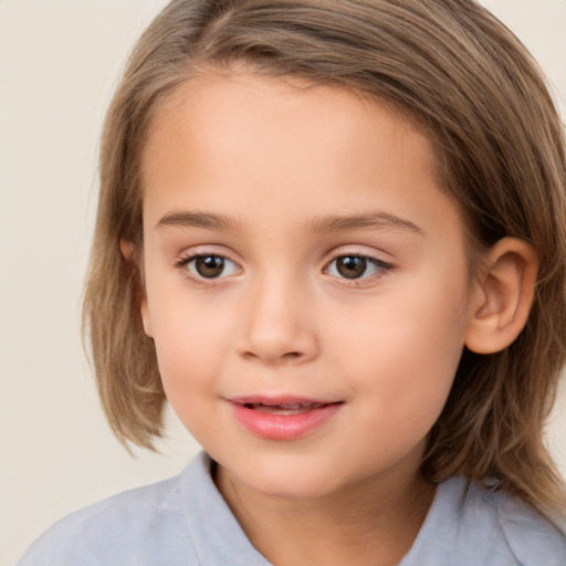 Joyful white child female with medium  brown hair and brown eyes