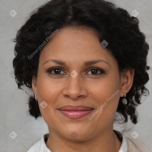 Joyful black adult female with medium  brown hair and brown eyes