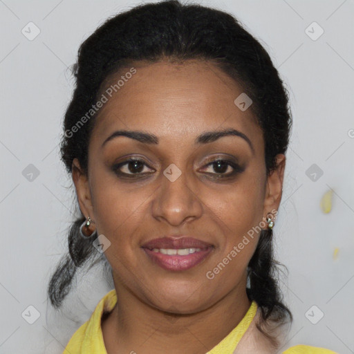 Joyful black adult female with short  brown hair and brown eyes