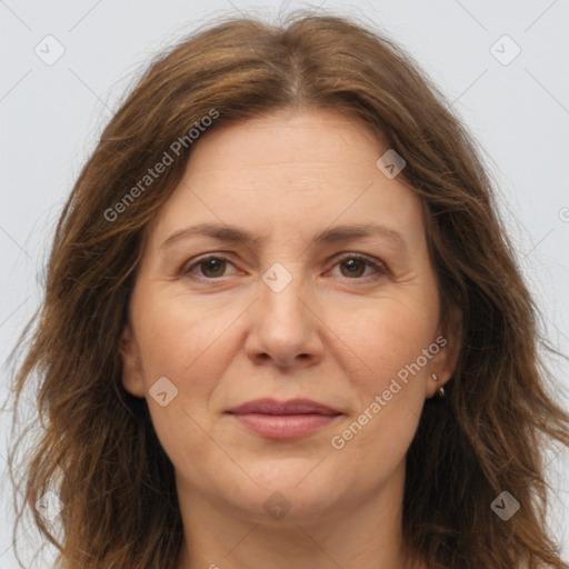 Joyful white adult female with long  brown hair and brown eyes