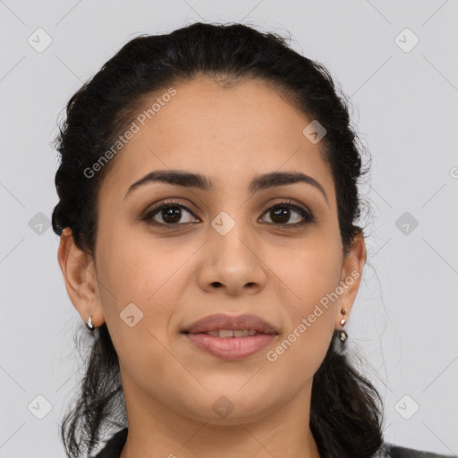 Joyful latino young-adult female with medium  brown hair and brown eyes