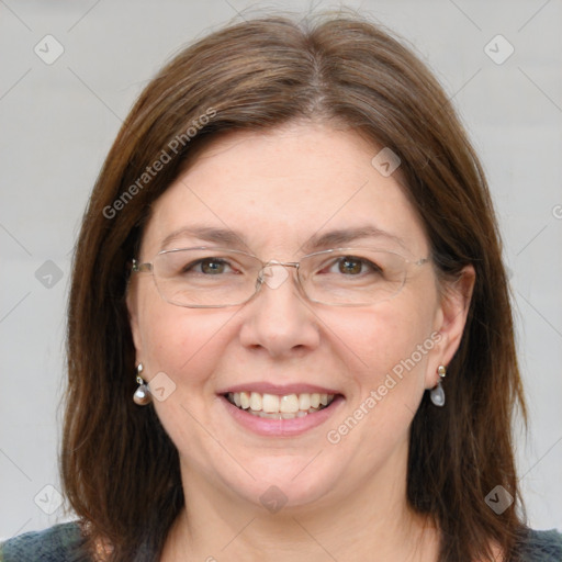 Joyful white adult female with medium  brown hair and blue eyes