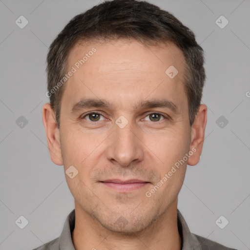 Joyful white adult male with short  brown hair and brown eyes