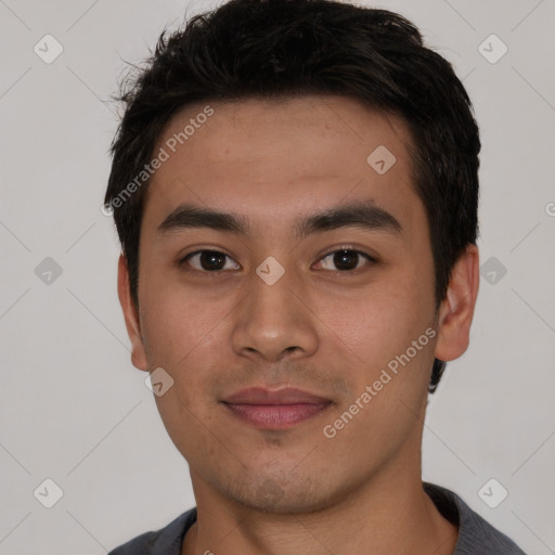 Joyful asian young-adult male with short  black hair and brown eyes